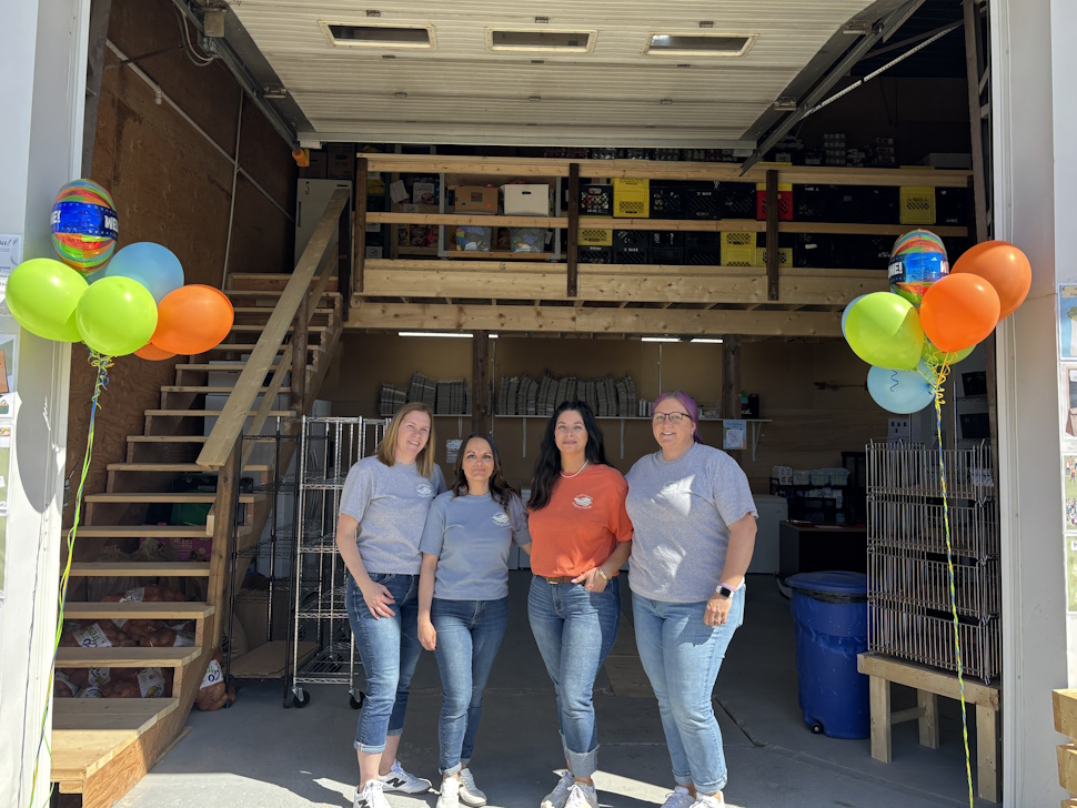 LHH founders stand inside new building after grand opening