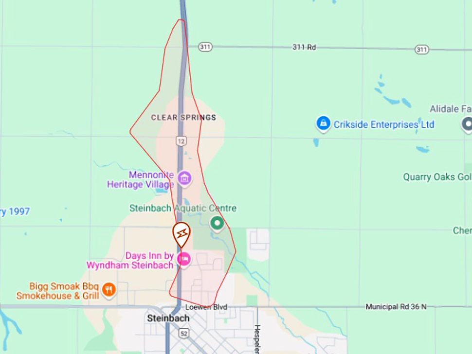 a map shows a large area outlined in red indicating a power outage