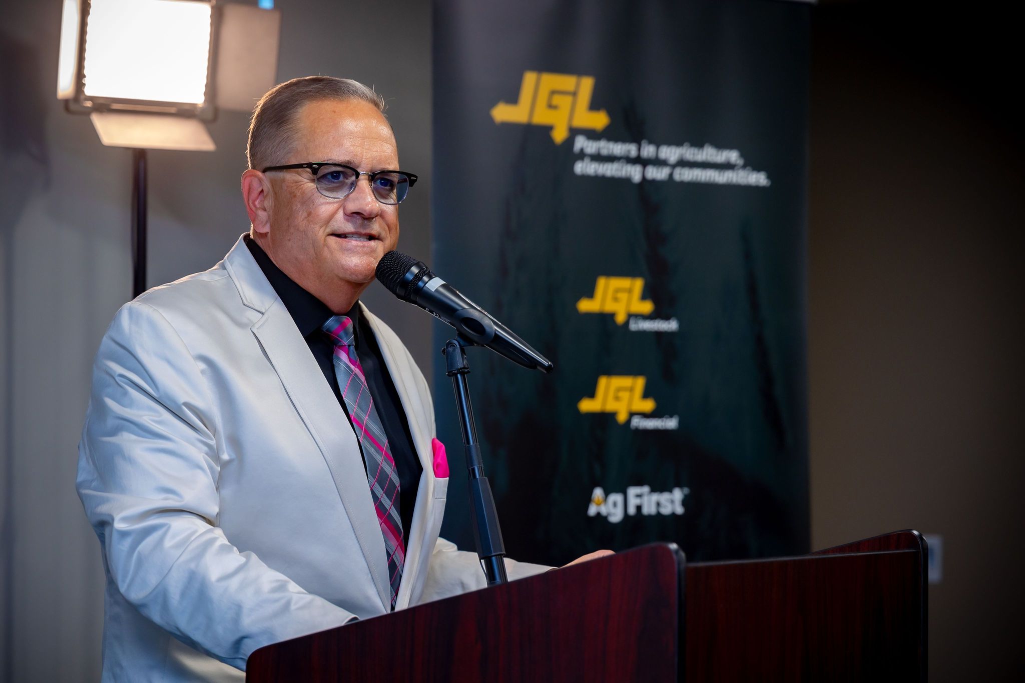 CHAB's Rob Carnie is shown in this photo, addressing a crowd at a podium at a recent event. 