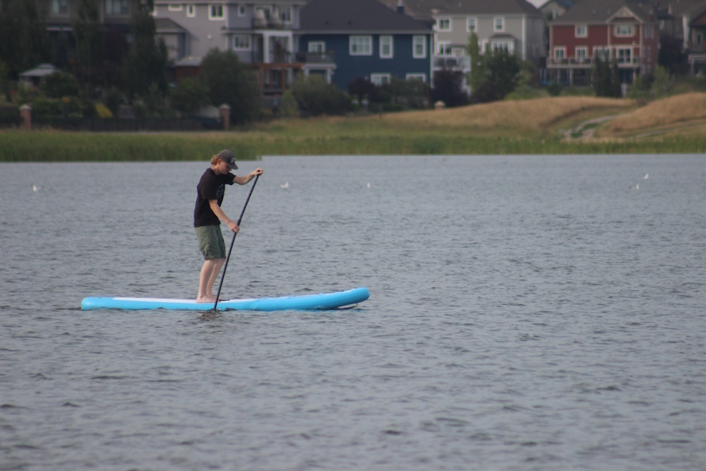 A man riding on Chestermere Lake.