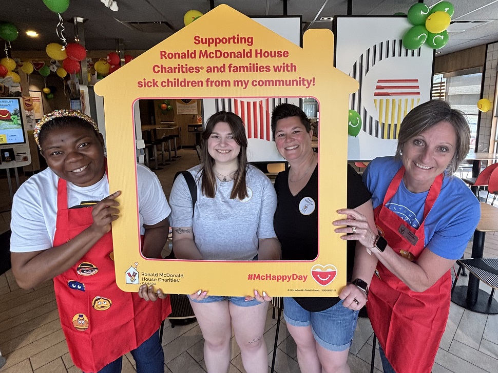 MCHAPPY DAY SIGN WITH PEOPLE SMILING