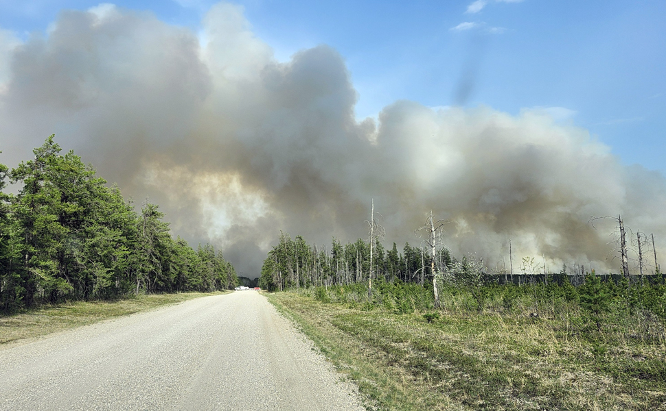 Smoke billowing from a wildfire in the RM of Piney near Carrick. (photo credit: Gary Hora) 