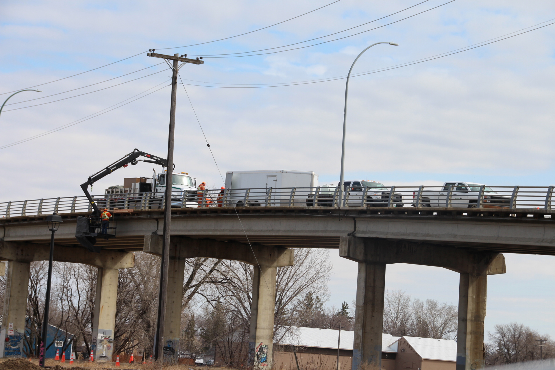 Tupper Street Bridge from a distance with working crews and trucks atop