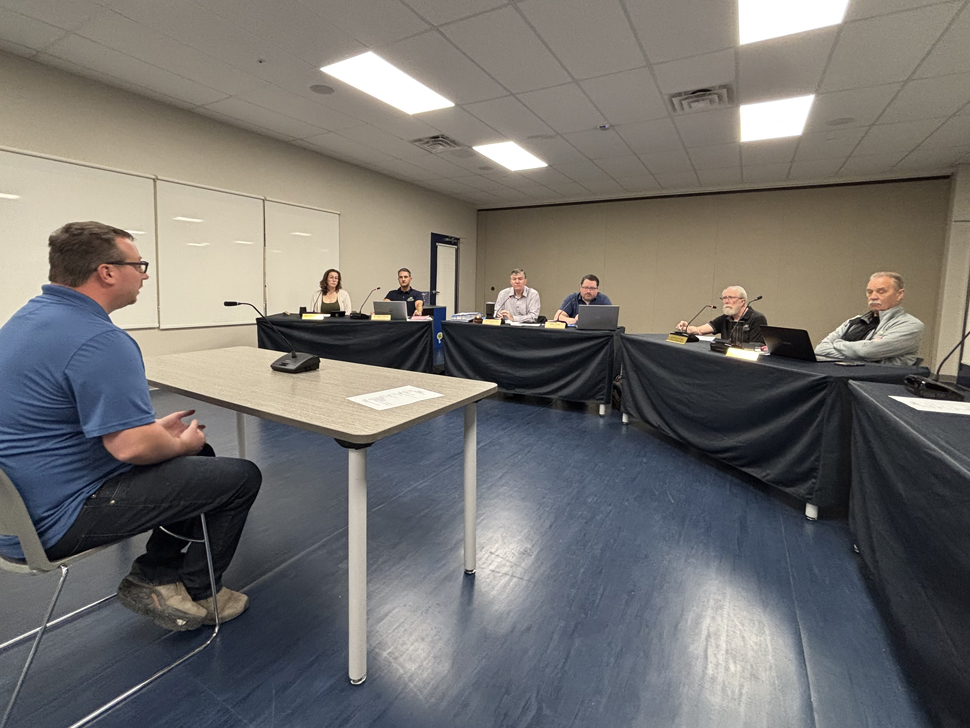 Niverville Town Councillors speaking with a representative of Rural Connections Ltd.