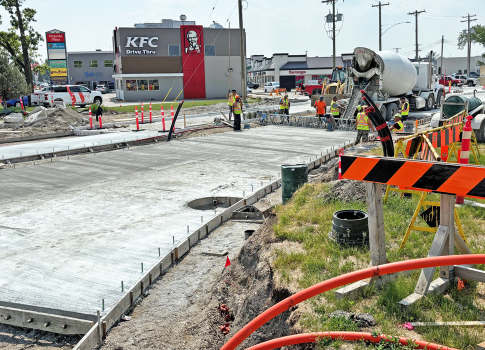 Crews pouring concrete along Highway 12 south in Steinbach