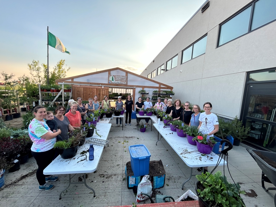 Attendees at the WeyStrong flower basket event