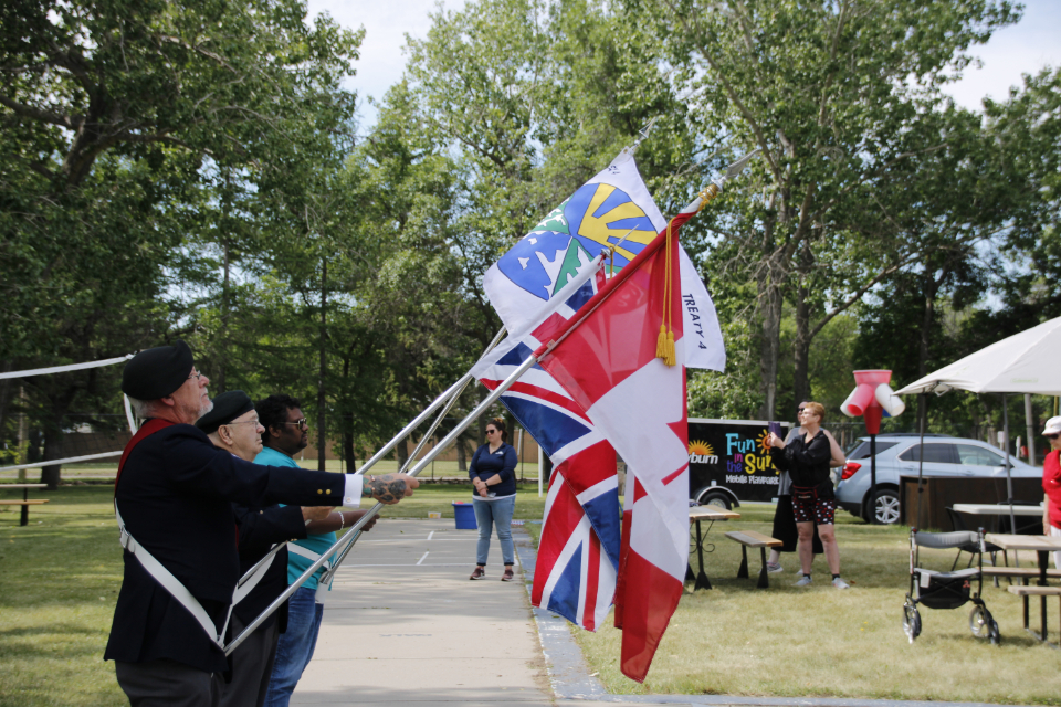 Men holding flags as part of a colour party