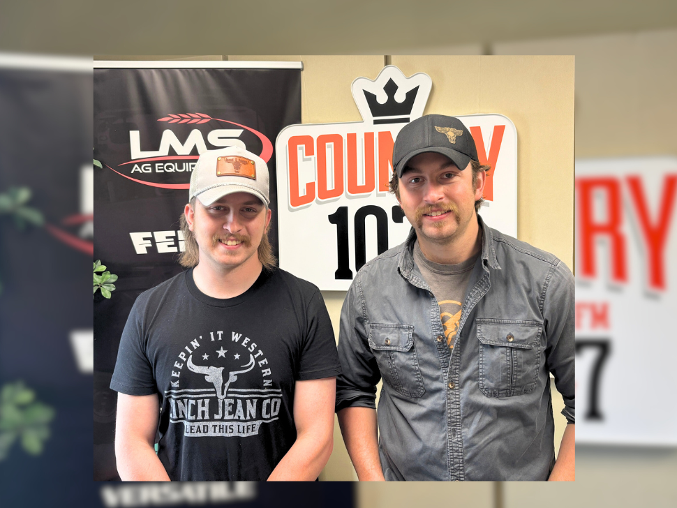 Jon and Dan stand in Country 107.7 studio