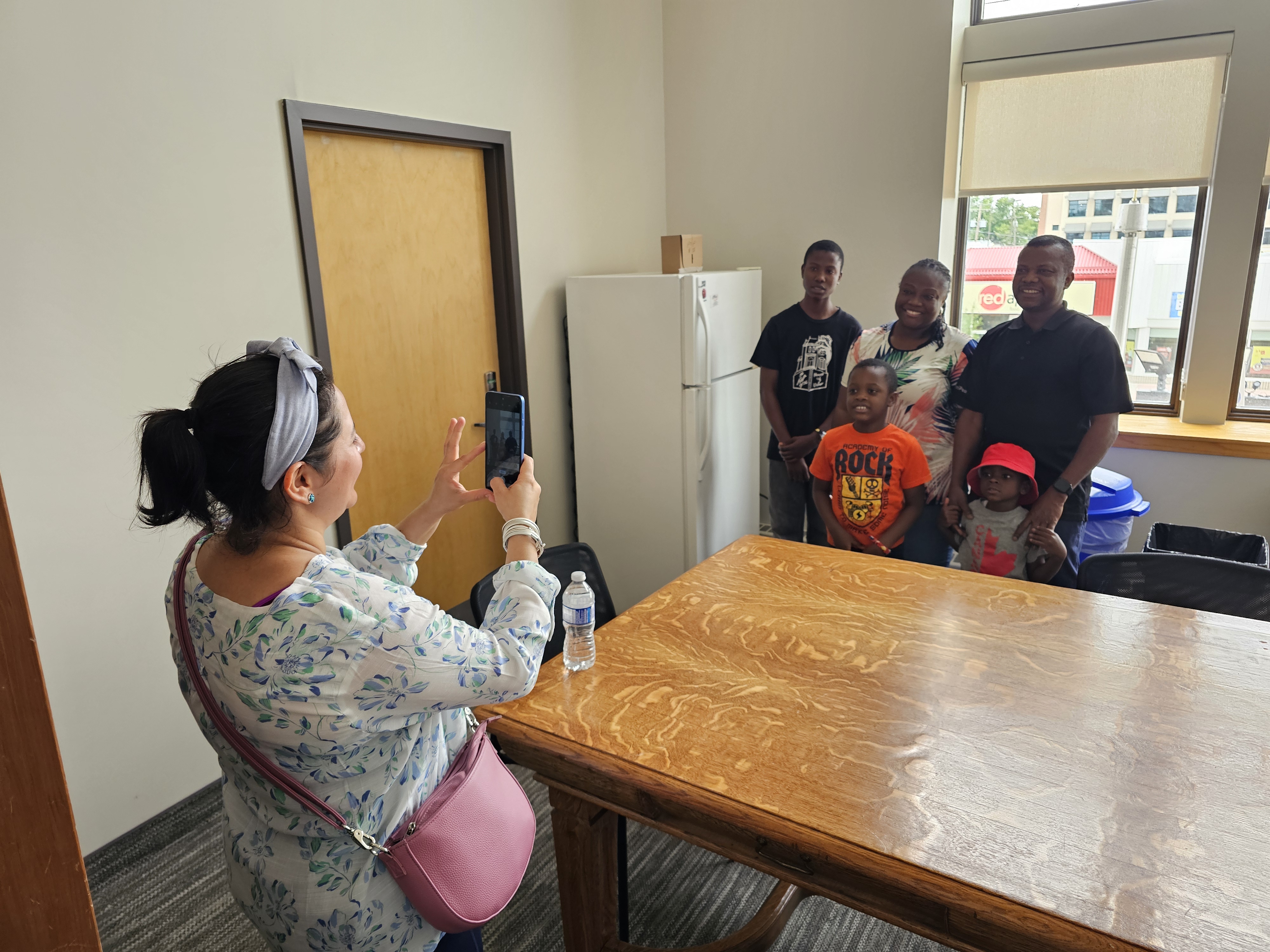 Families and tour members take pictures together of their time