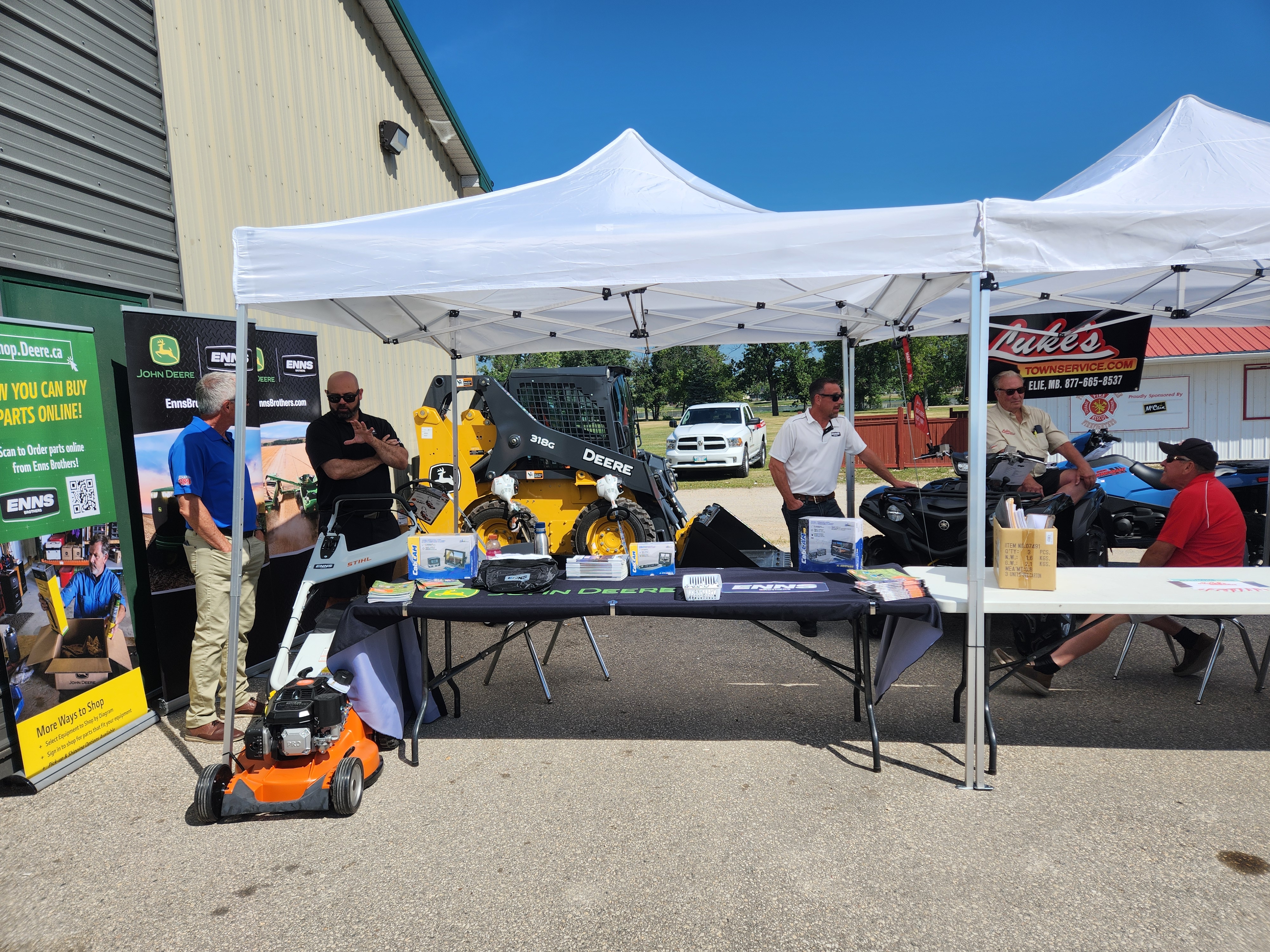 Enns Brothers Portage, having their table out with some equipment in front.  PortageOnline/ Tristen Sokolosky