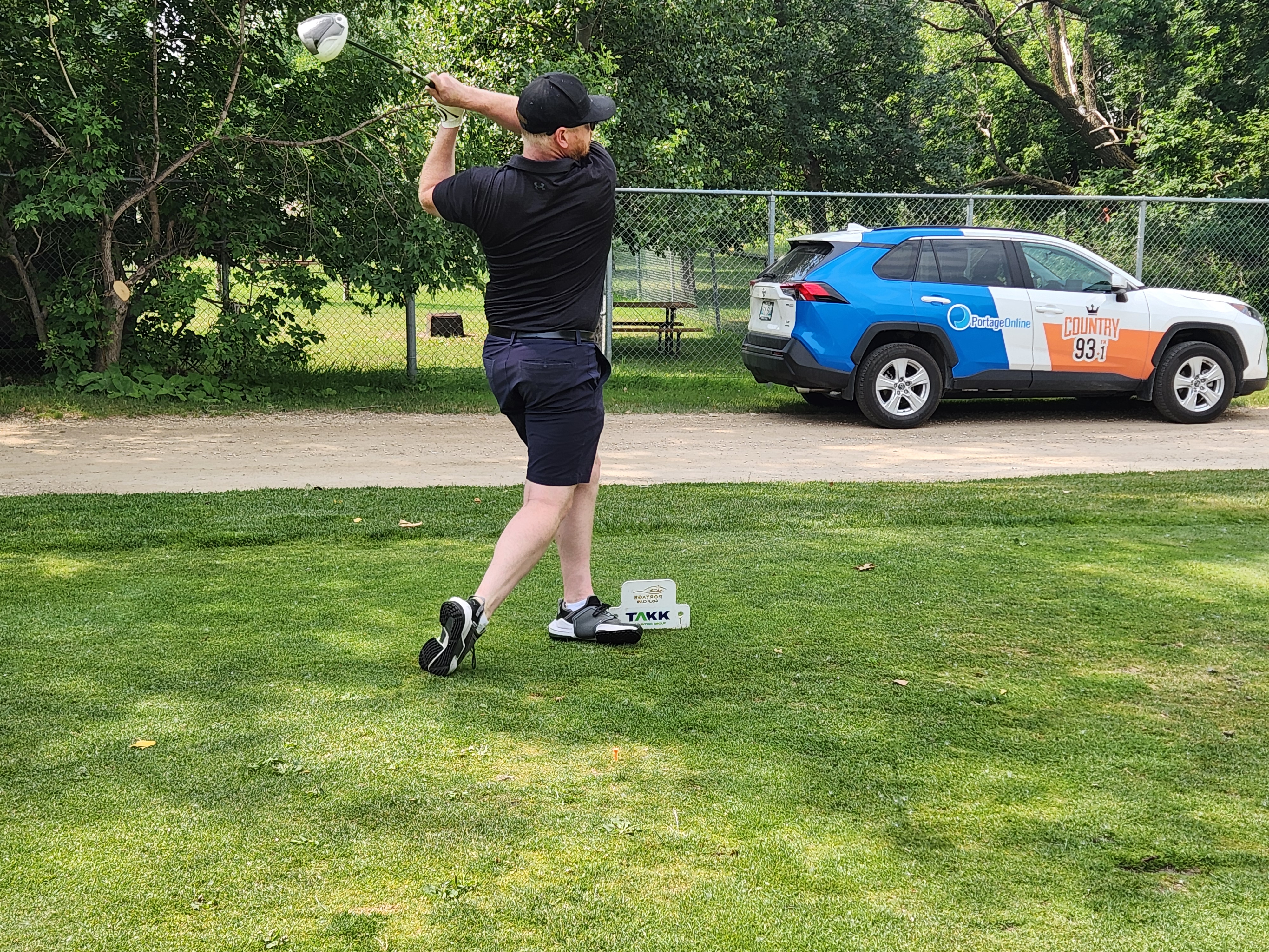 A golfer follows through on a strong drive under hot, humid skies during Stride’s fundraising tournament at Portage Golf Club. PortageOnline/ Tristen Sokolosky