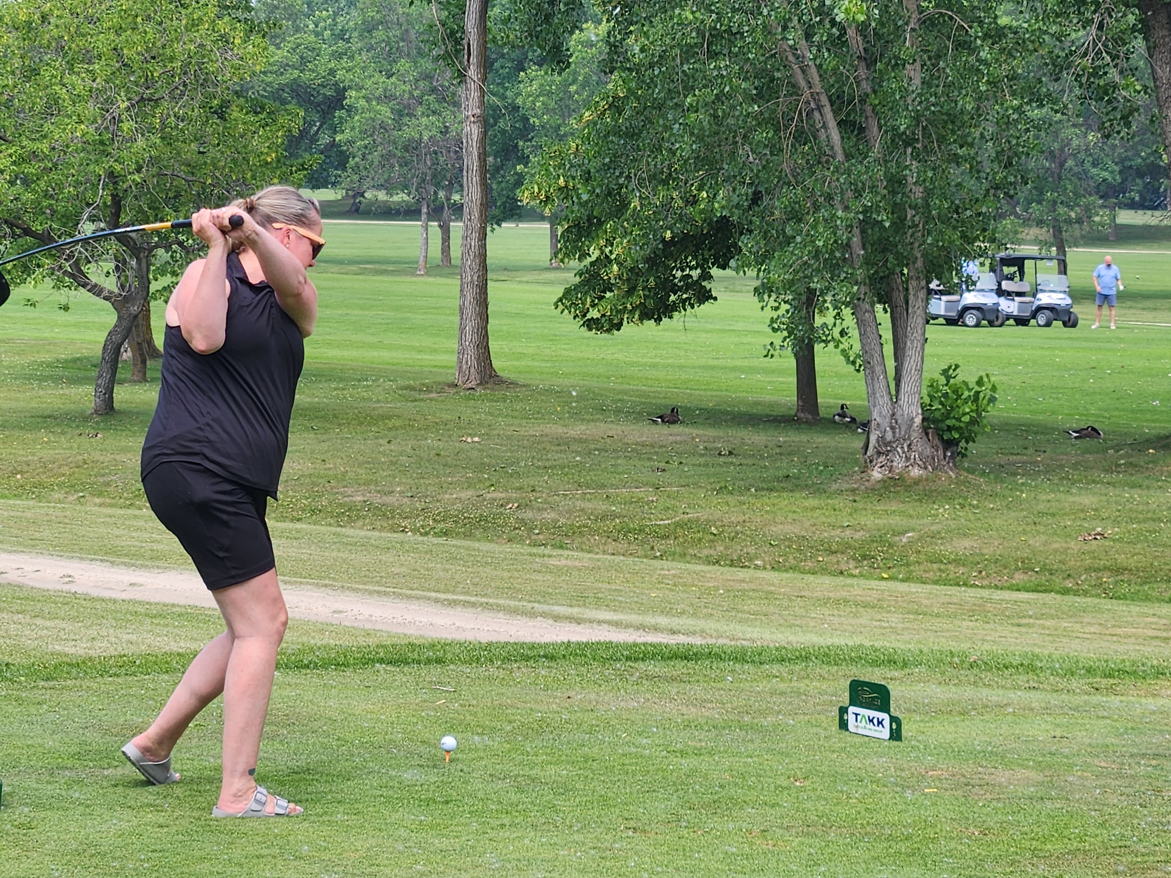 A golfer follows through on a strong drive under hot, humid skies during Stride’s fundraising tournament at Portage Golf Club. PortageOnline/ Tristen Sokolosky