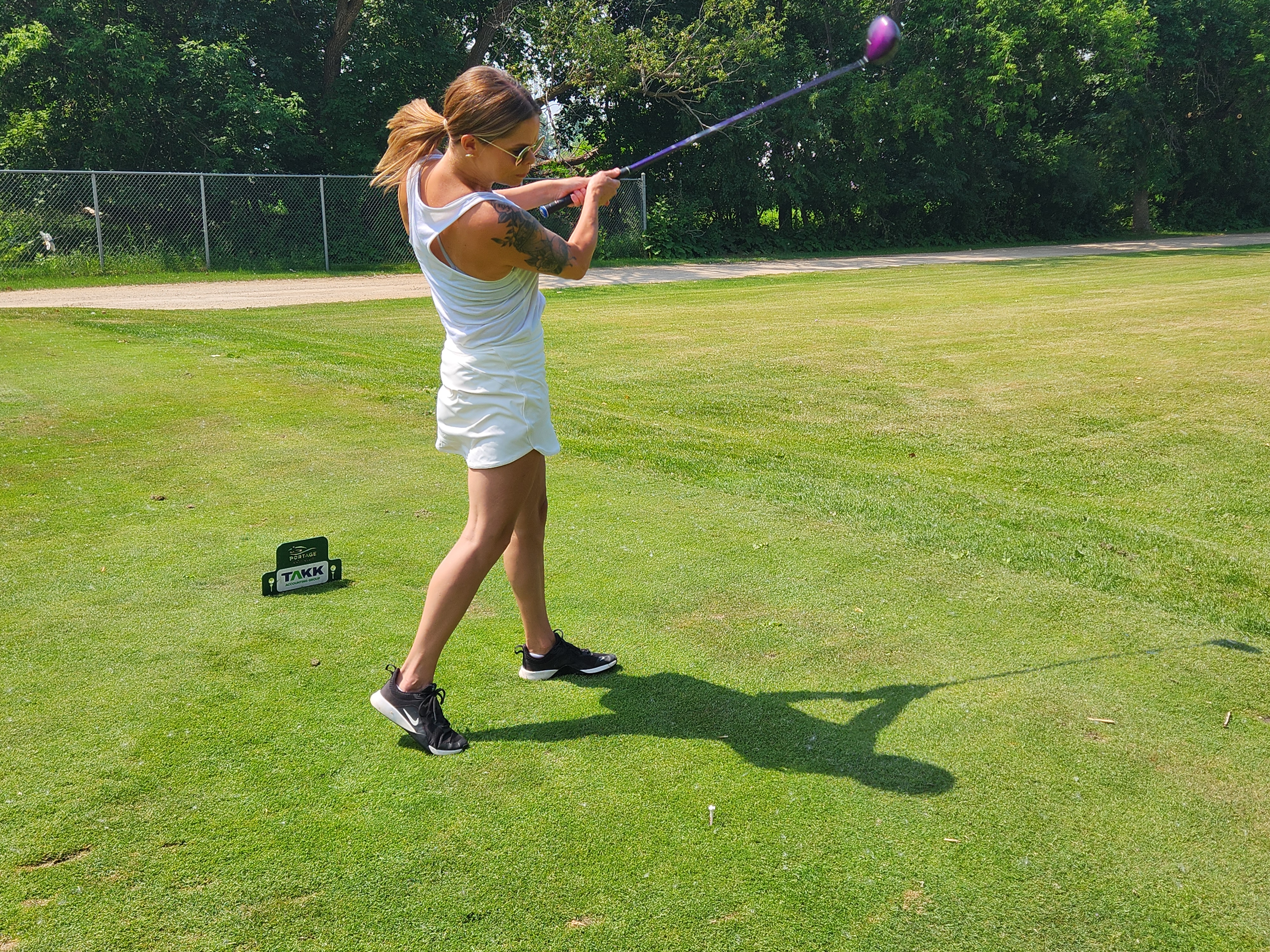 A golfer follows through on a strong drive under hot, humid skies during Stride’s fundraising tournament at Portage Golf Club. PortageOnline/ Tristen Sokolosky