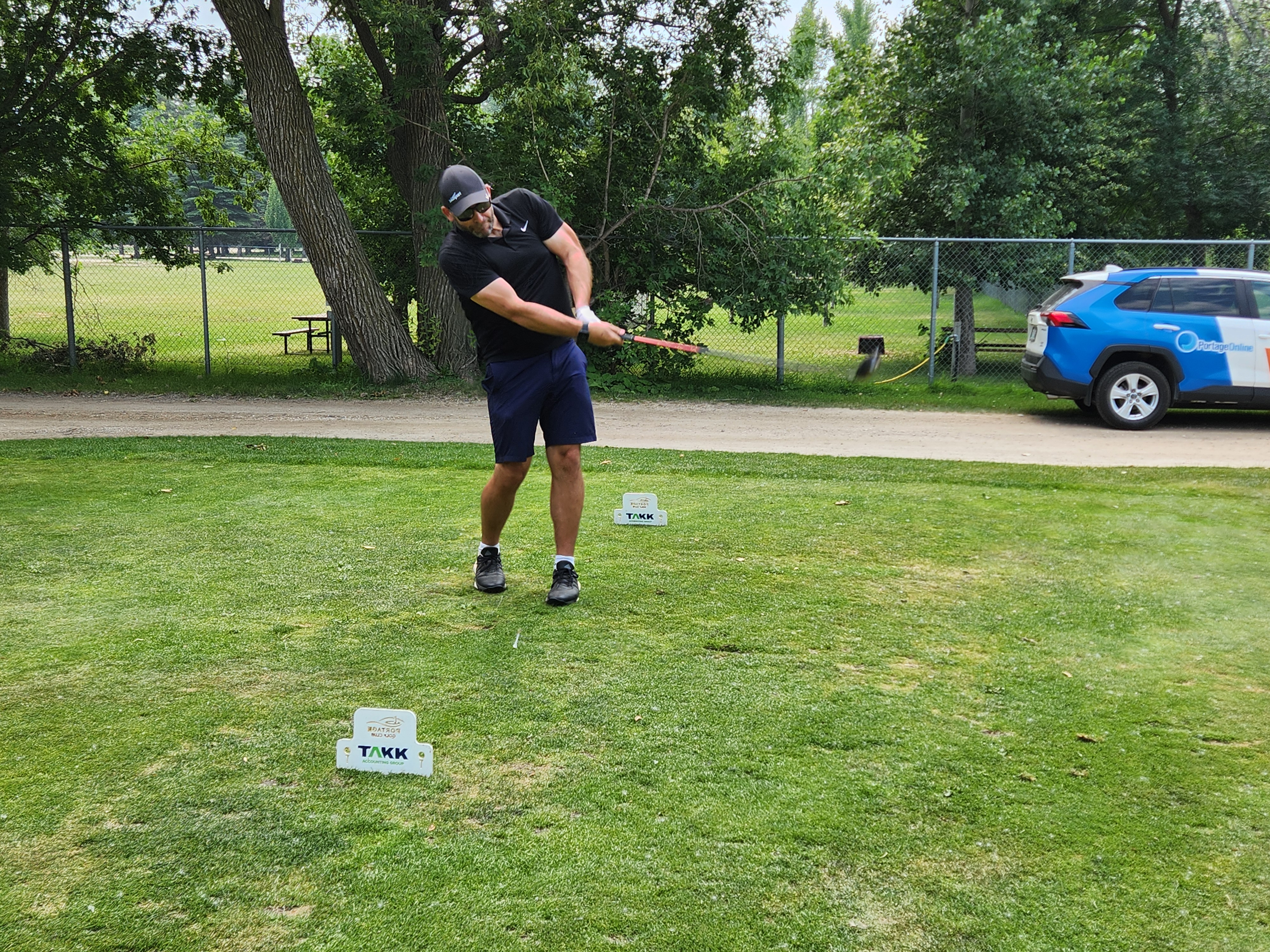 A golfer follows through on a strong drive under hot, humid skies during Stride’s fundraising tournament at Portage Golf Club. PortageOnline/ Tristen Sokolosky