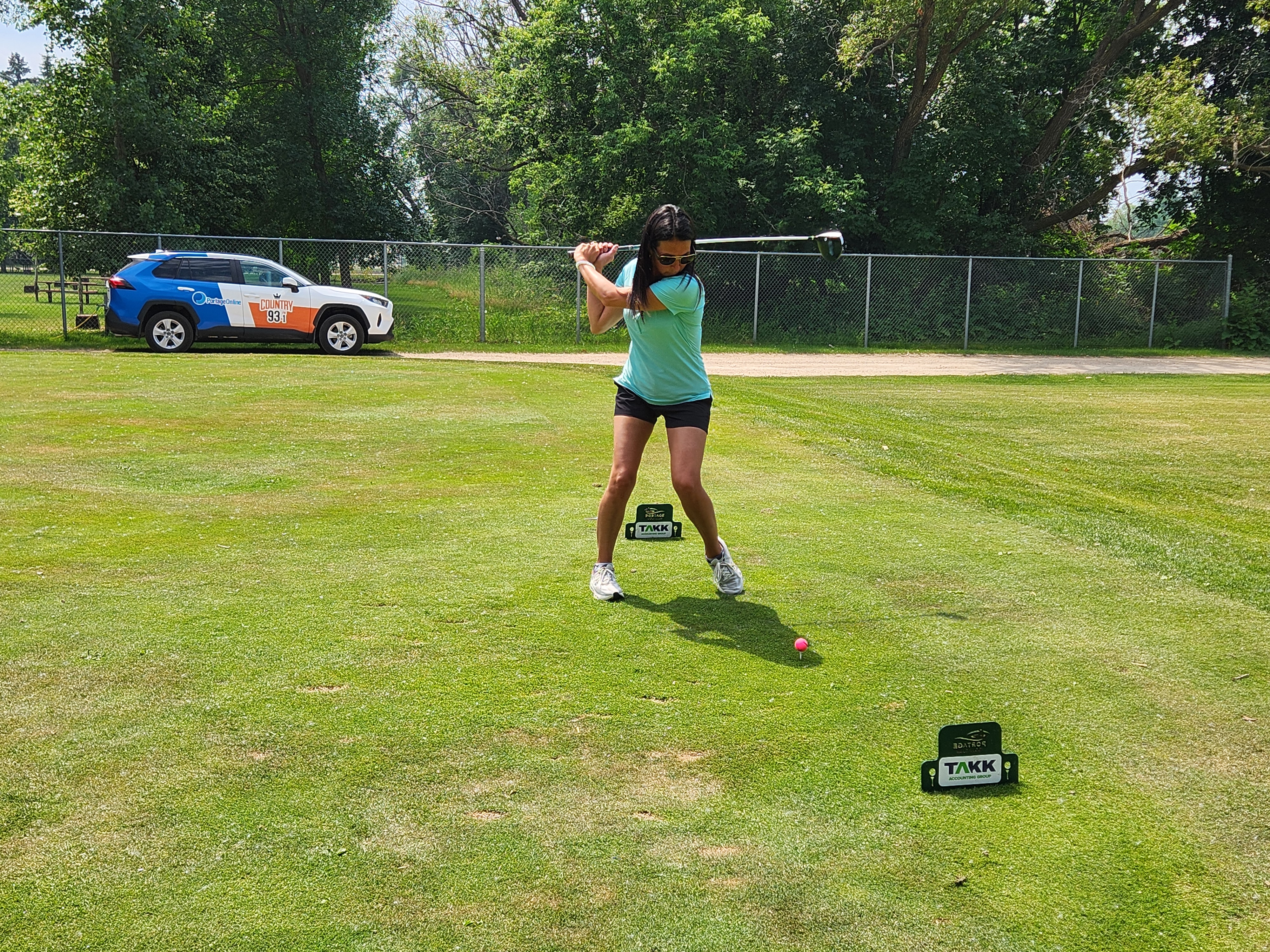 A golfer follows through on a strong drive under hot, humid skies during Stride’s fundraising tournament at Portage Golf Club. PortageOnline/ Tristen Sokolosky
