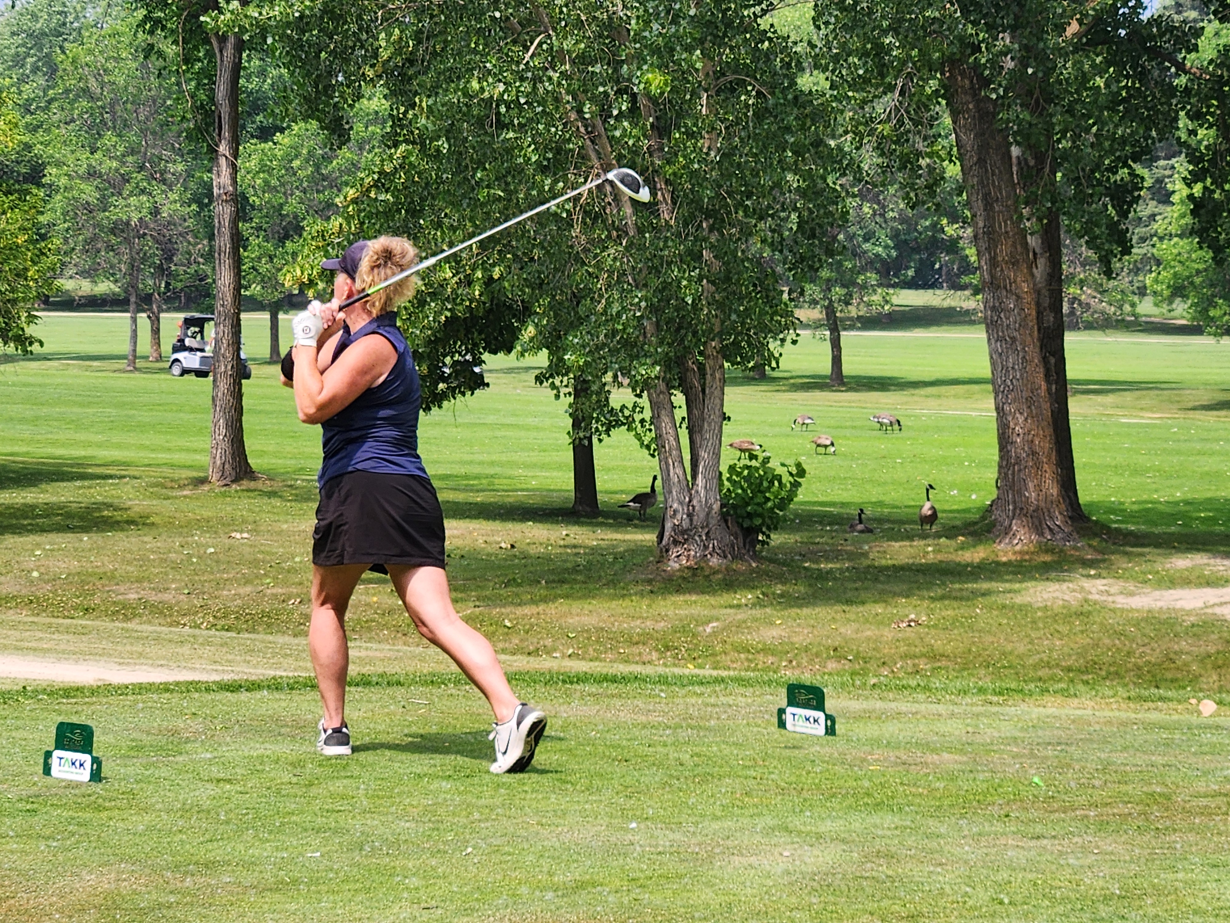 A golfer follows through on a strong drive under hot, humid skies during Stride’s fundraising tournament at Portage Golf Club. PortageOnline/ Tristen Sokolosky