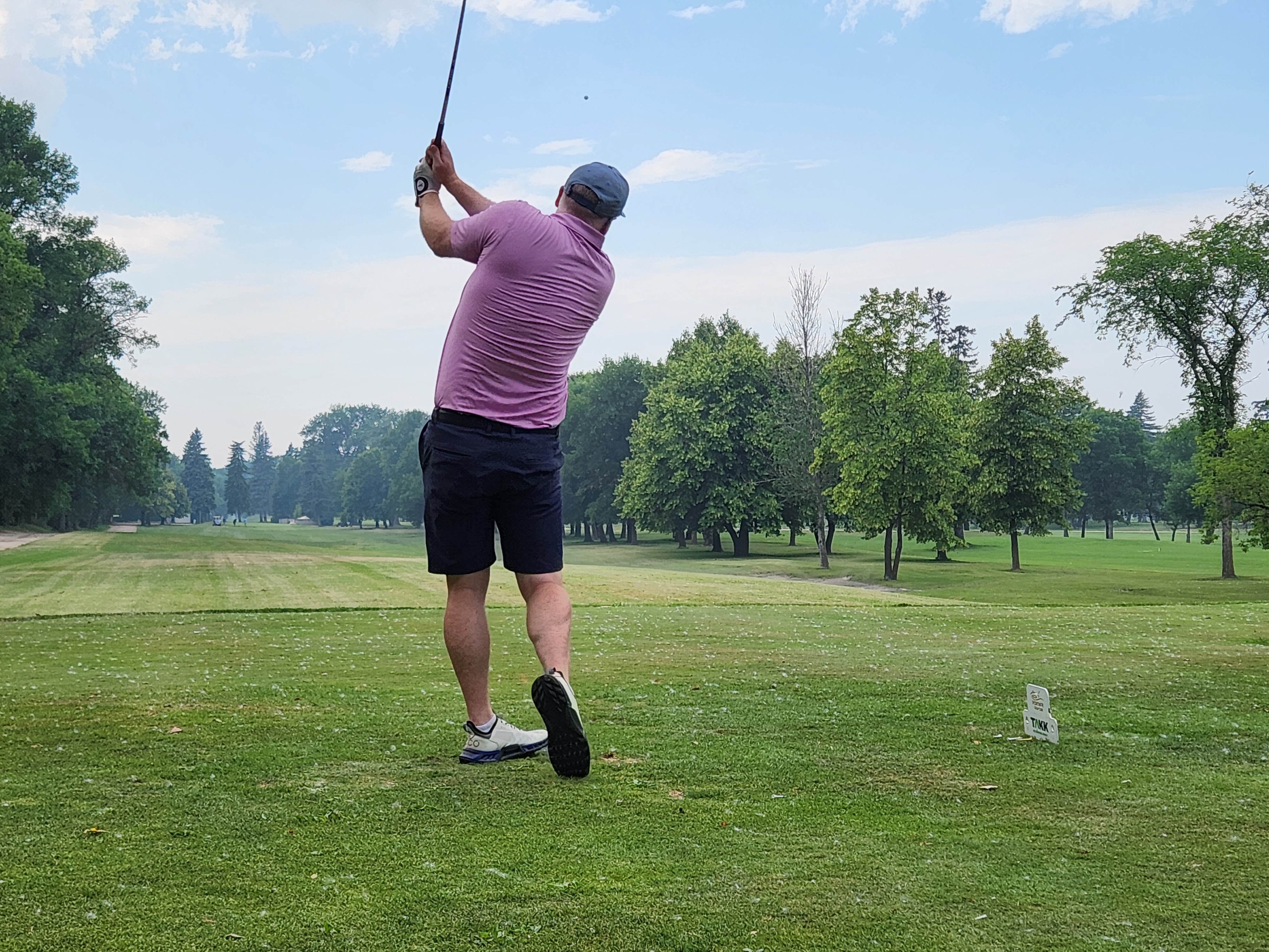 A golfer follows through on a strong drive under hot, humid skies during Stride’s fundraising tournament at Portage Golf Club. PortageOnline/ Tristen Sokolosky