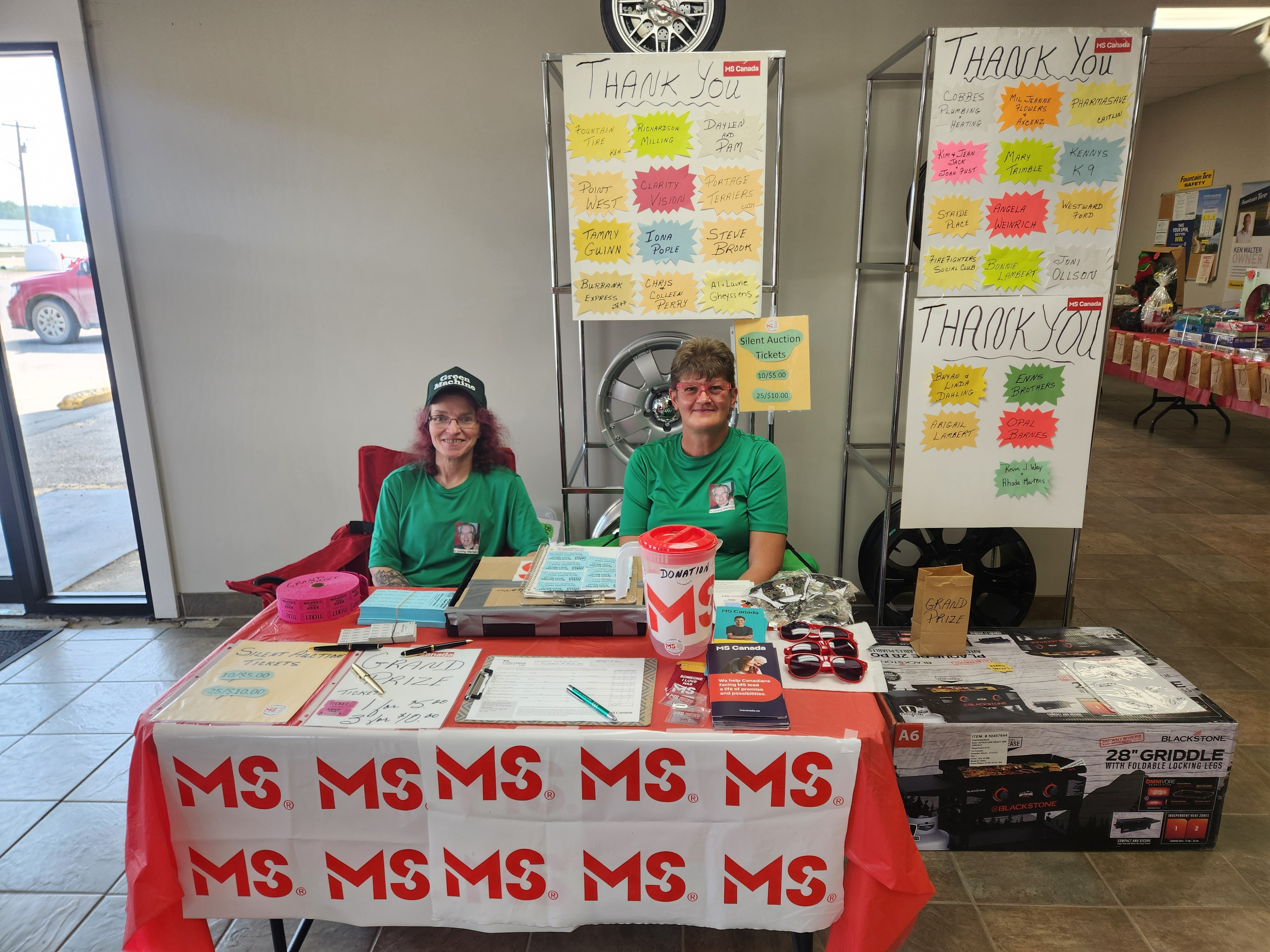 Silent auction tickets were available to buy, as well as the food ticket form these ladies.    PortageOnline/ Tristen Sokolosky