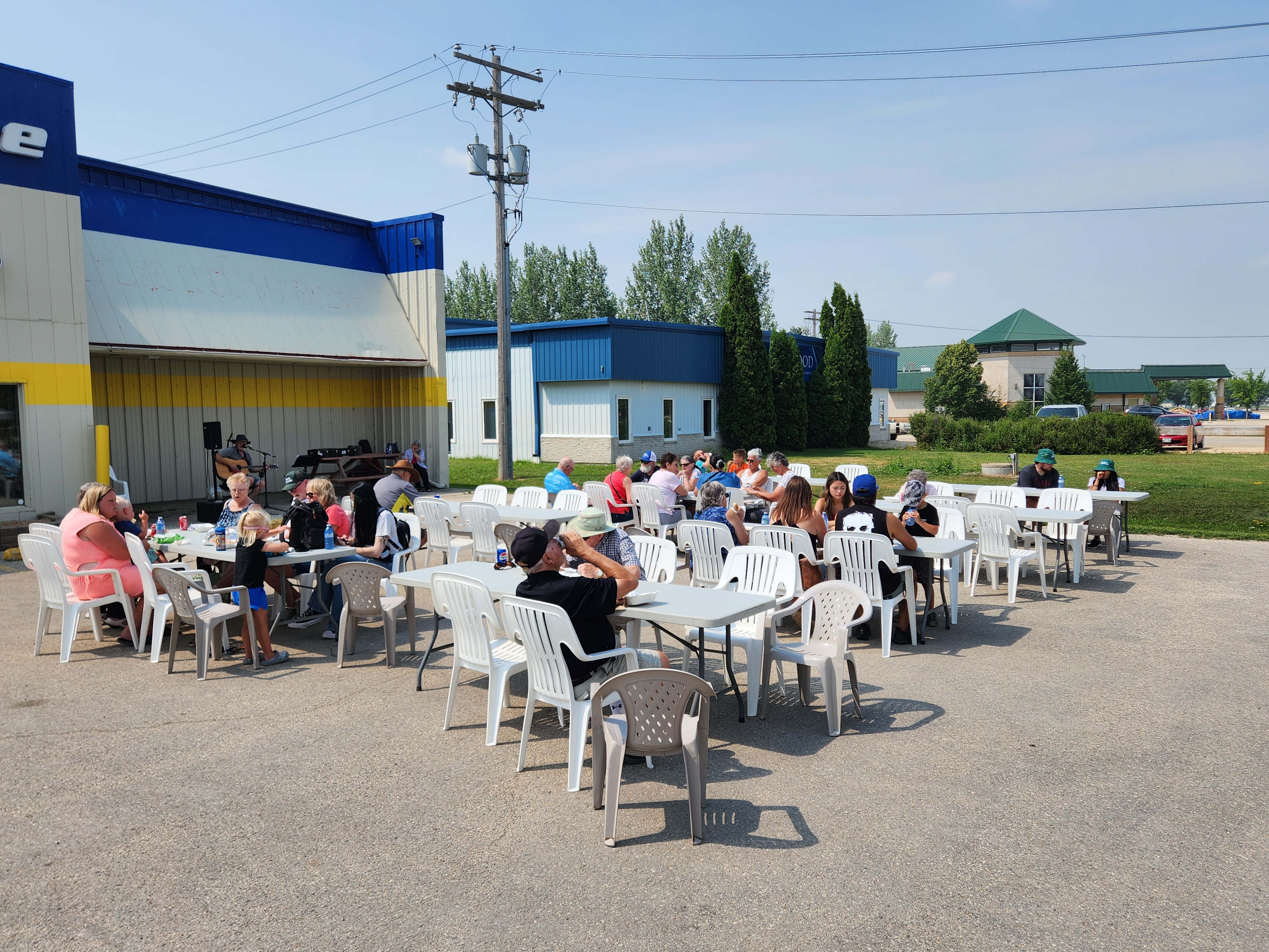 Crowd showing up slowly, and sitting down to eat their food and listen to some music.   PortageOnline/ Tristen Sokolosky