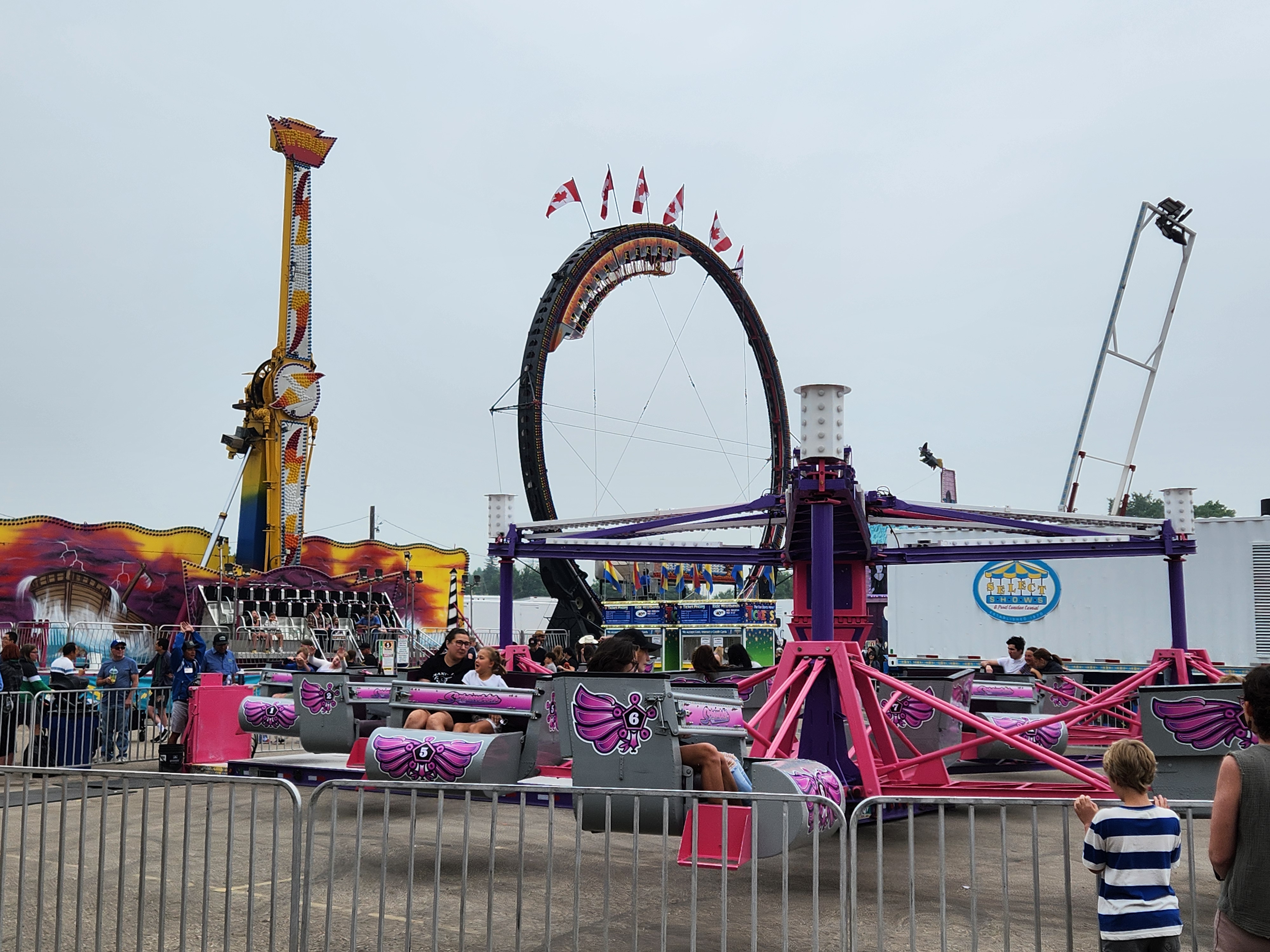 Crowds gather under cloudy skies for a fun-filled afternoon at the Morris Stampede Midway, where colourful rides, carnival games, and family memories take center stage. PortageOnline/ Tristen Sokolosky