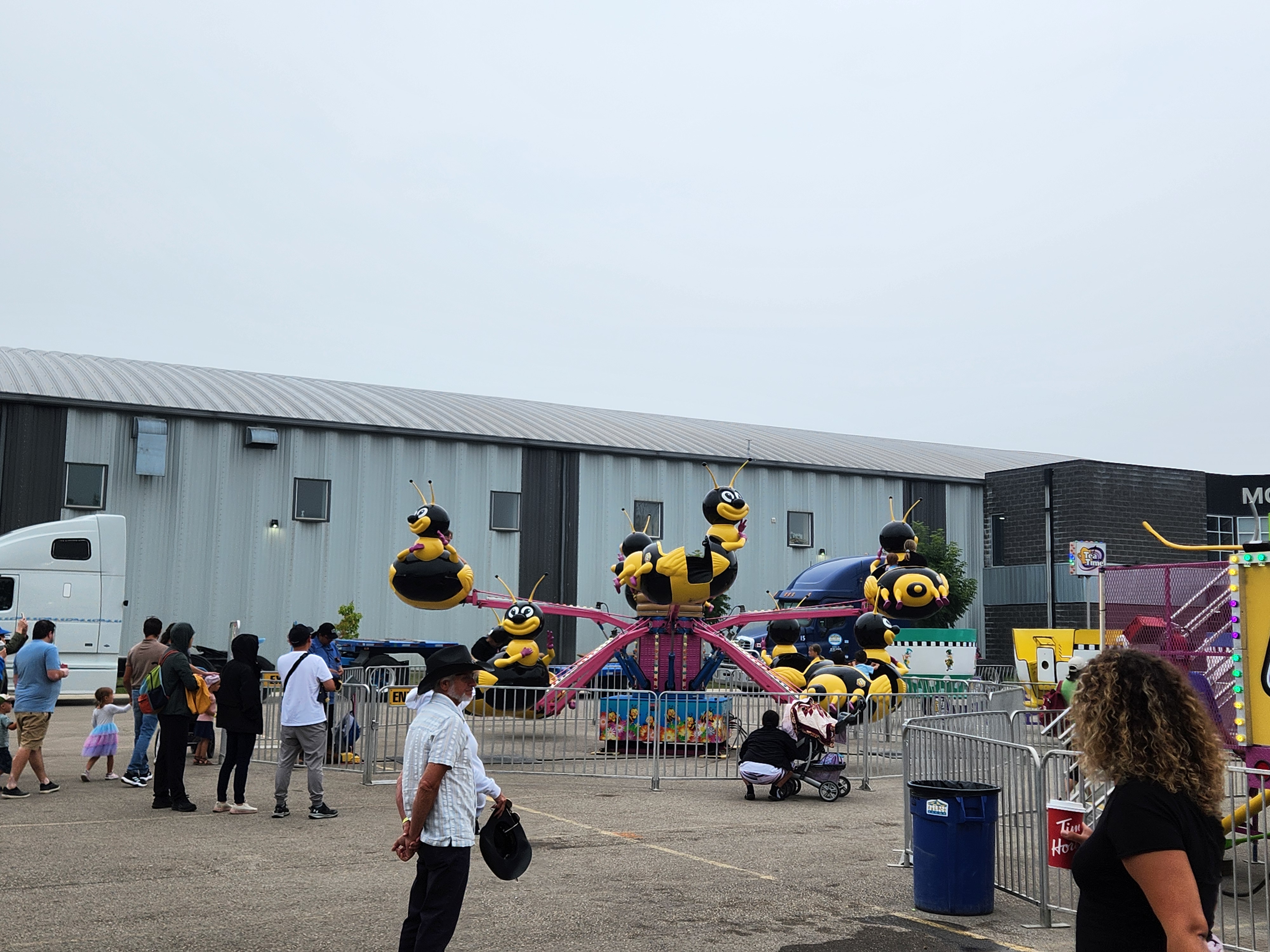 Crowds gather under cloudy skies for a fun-filled afternoon at the Morris Stampede Midway, where colourful rides, carnival games, and family memories take center stage. PortageOnline/ Tristen Sokolosky