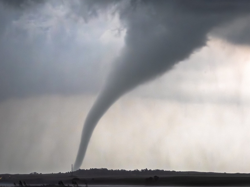 A tornado moves across the countryside in southern Manitoba in June of 2025.