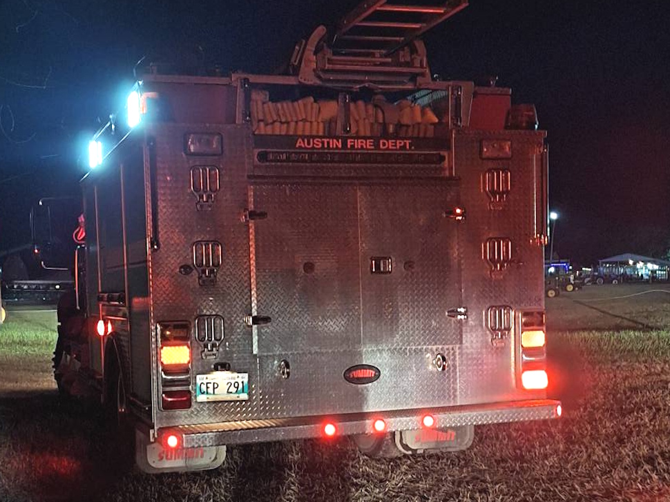 Austin Fire Department truck parked at the Manitoba Agricultural Museum during an emergency response at night.