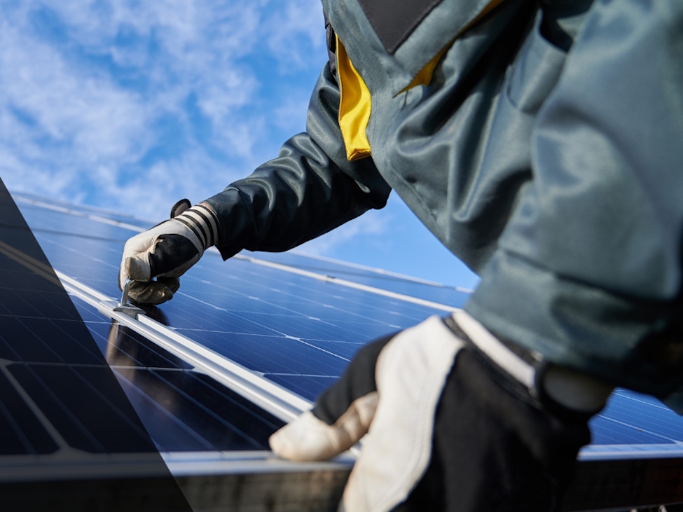 a person installing a solar panel