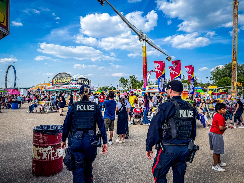 two police officers at a summer fair