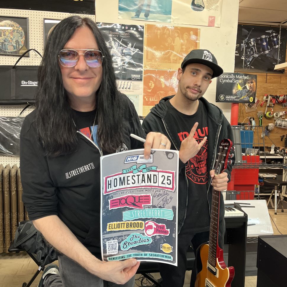 Brent Fitz of TOQUE signs posters and meets fans at John's Music in Moose Jaw, as part of the announcement the band will headline Homestand '25 (Cameron Howe)