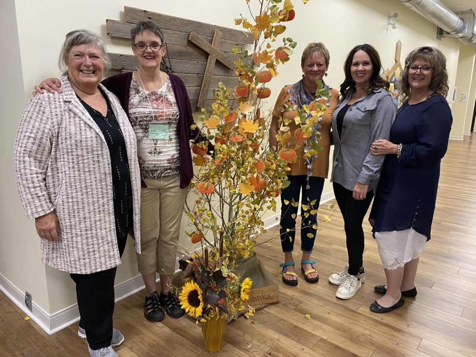 Five women standing together for the picture