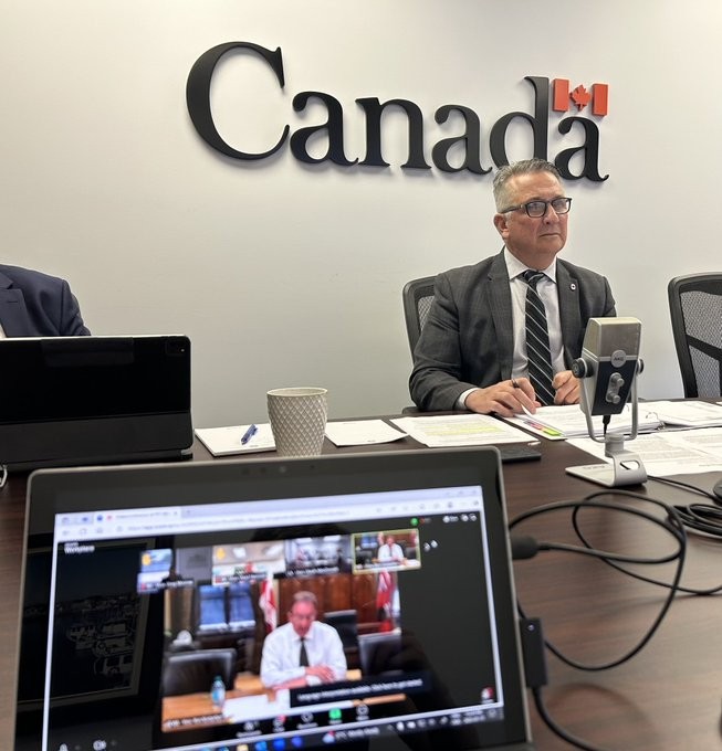 Federal Ag Minister Heath MacDonald at a table