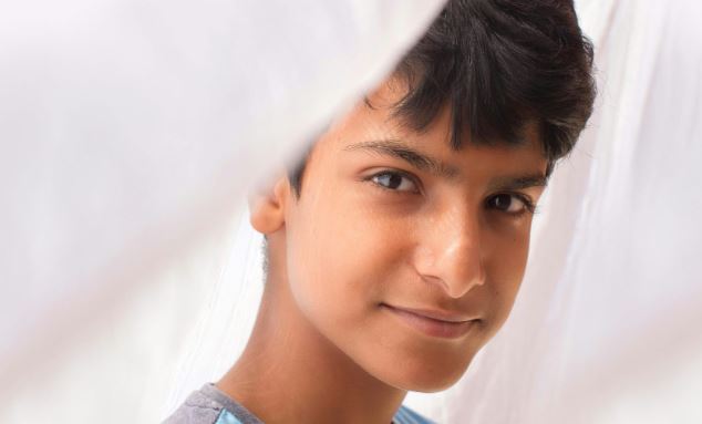 Iranian boy. (Photo courtesy of Achraf Talha via Unsplash)