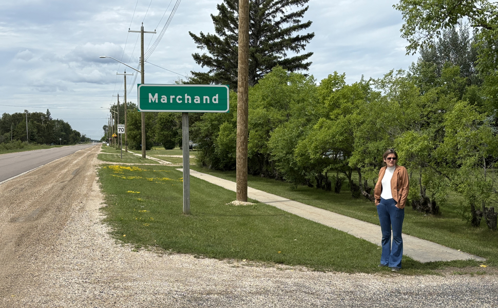 Marchand resident, Jacquie Loeppky standing at the end of her driveway where the posted speed limit is 100km.