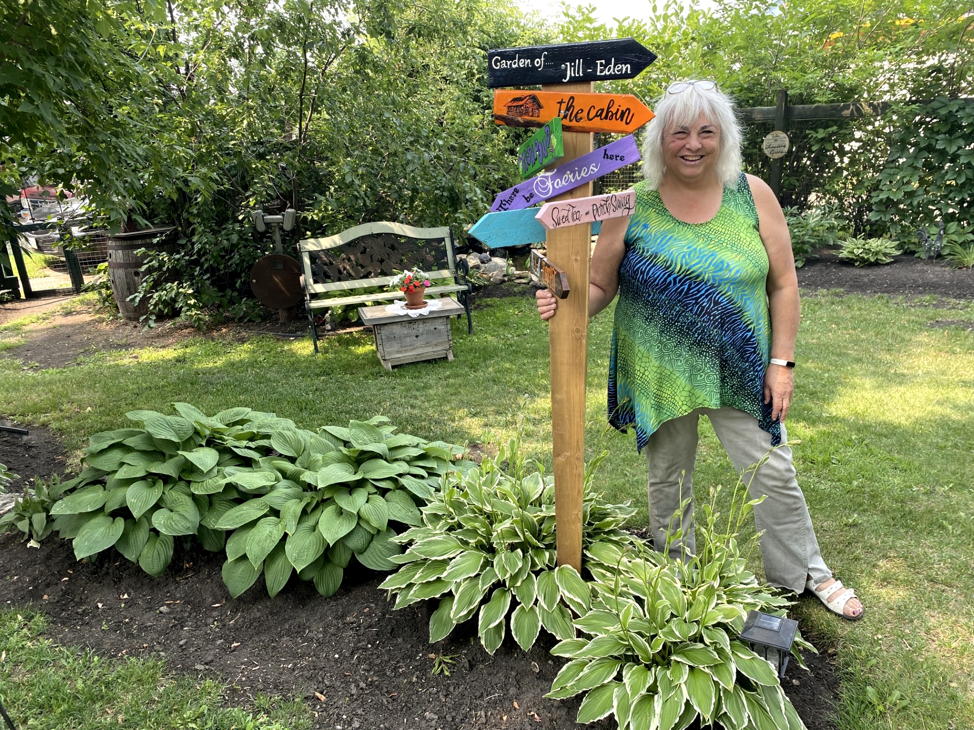 a woman standing in a garden