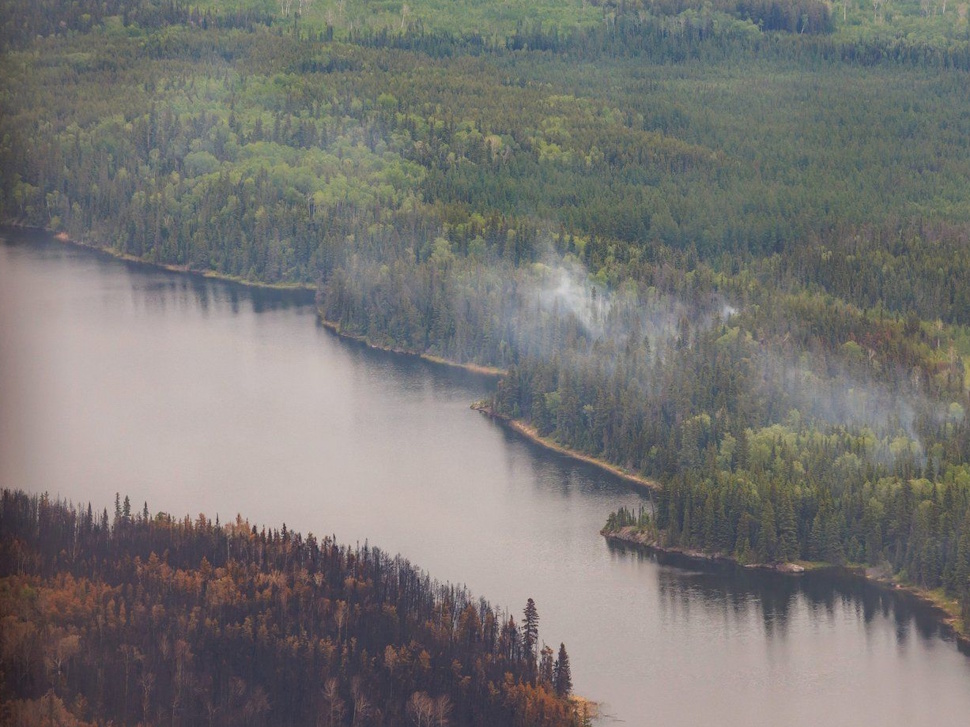 Trees burned by wildfires in northern Manitoba are shown during a helicopter tour in the surrounding area of Flin Flon, Man. on Thursday, June 12, 2025. THE CANADIAN PRESS/Mike Deal