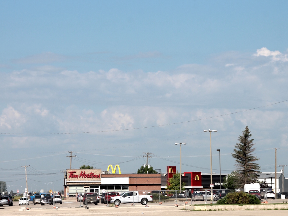 Dark, ominous storm clouds loom over fast food restaurants on the west end of Portage la Prairie.