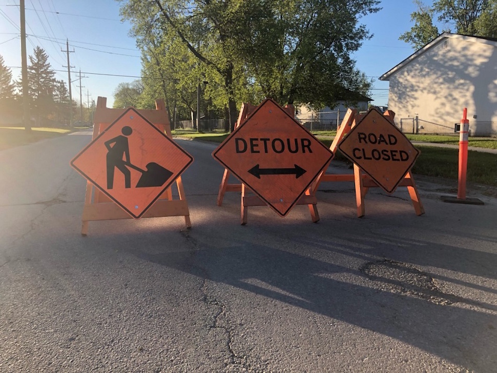 Road work signs mark a temporary closure in Portage la Prairie, where crews are busy with water line repairs and road construction projects across the city. PortageOnline/News Team