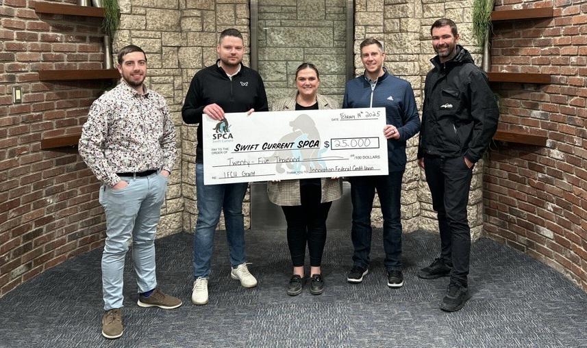 Innovation Federal Credit Union and SPCA Swift Current members pose with the donation. (photo courtesy of the SPCA Swift Current)