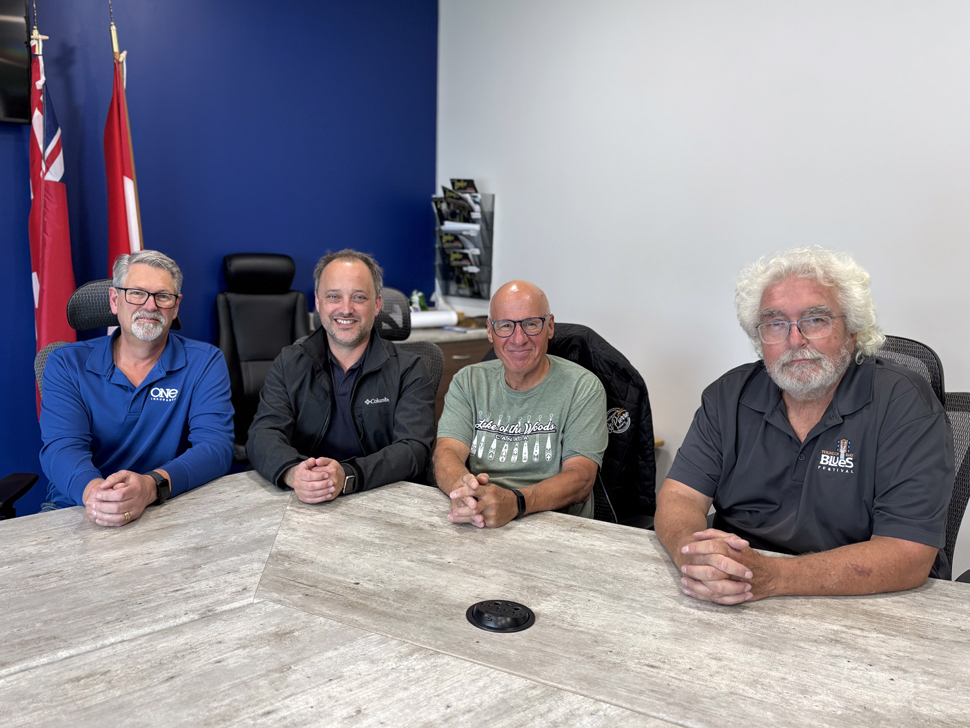 Village of  St Pierre-Jolys Mayor, Raymond Maynard (far left), Dany Robidoux, Pierre Gagne and Rolly Gagne (far right) in the village council chambers, talking about the exciting Supportive Living project.