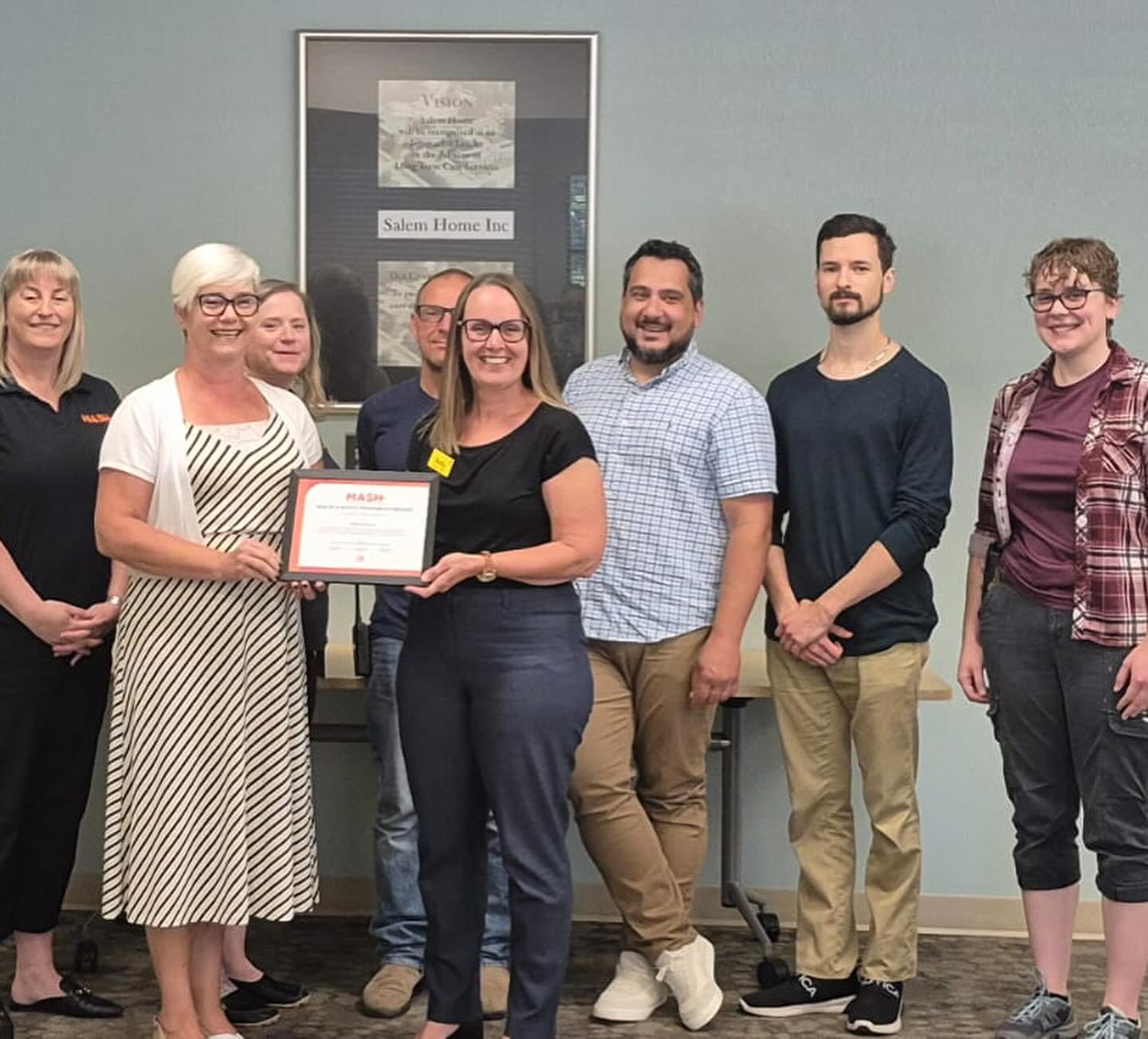 Group photo with certificate