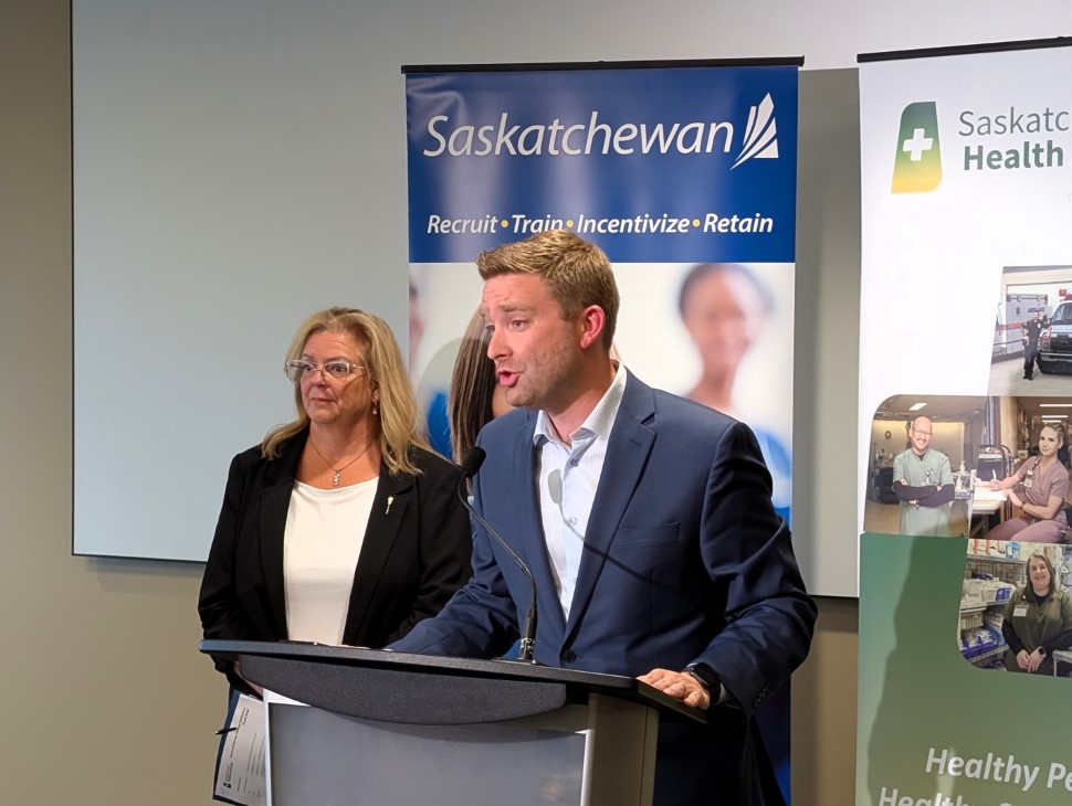 Saskatchewan Party ministers Lori Carr and Jeremy Cockrill answer questions after a press conference (photo by Gordon Edgar)