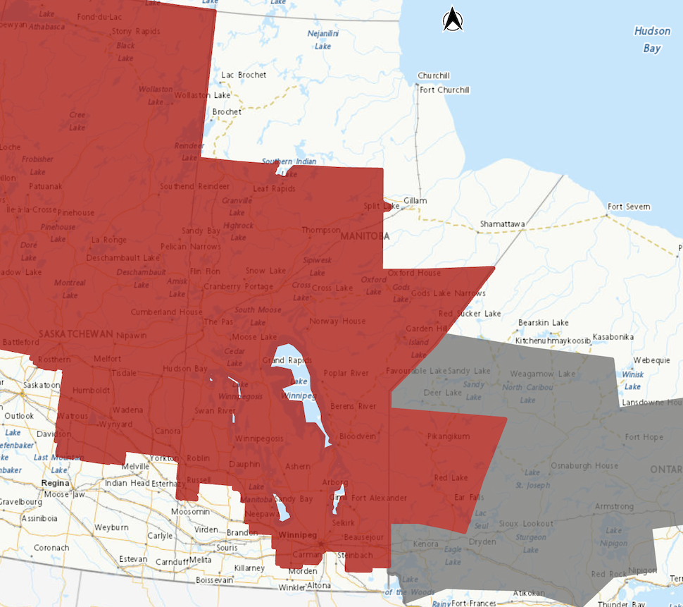 A MAP SHOWS MUCH OF MANITOBA HIGHLIGHTED IN RED