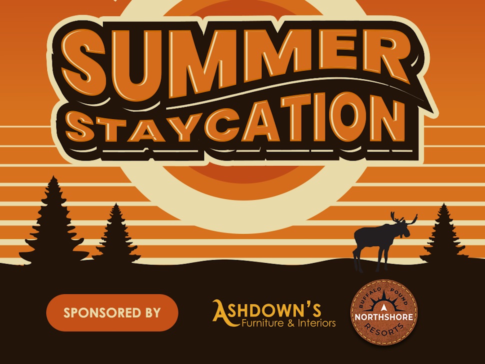 The image is a promotional poster for the 'Summer Staycation' contest. The background features an orange sunset with concentric circles and silhouettes of pine trees and a moose. The text 'SUMMER STAYCATION' is prominently displayed in bold, stylized letters. Below the main text, it says 'SPONSORED BY' followed by the logos of Ashdown's Furniture & Interiors and Northshore Resorts.
