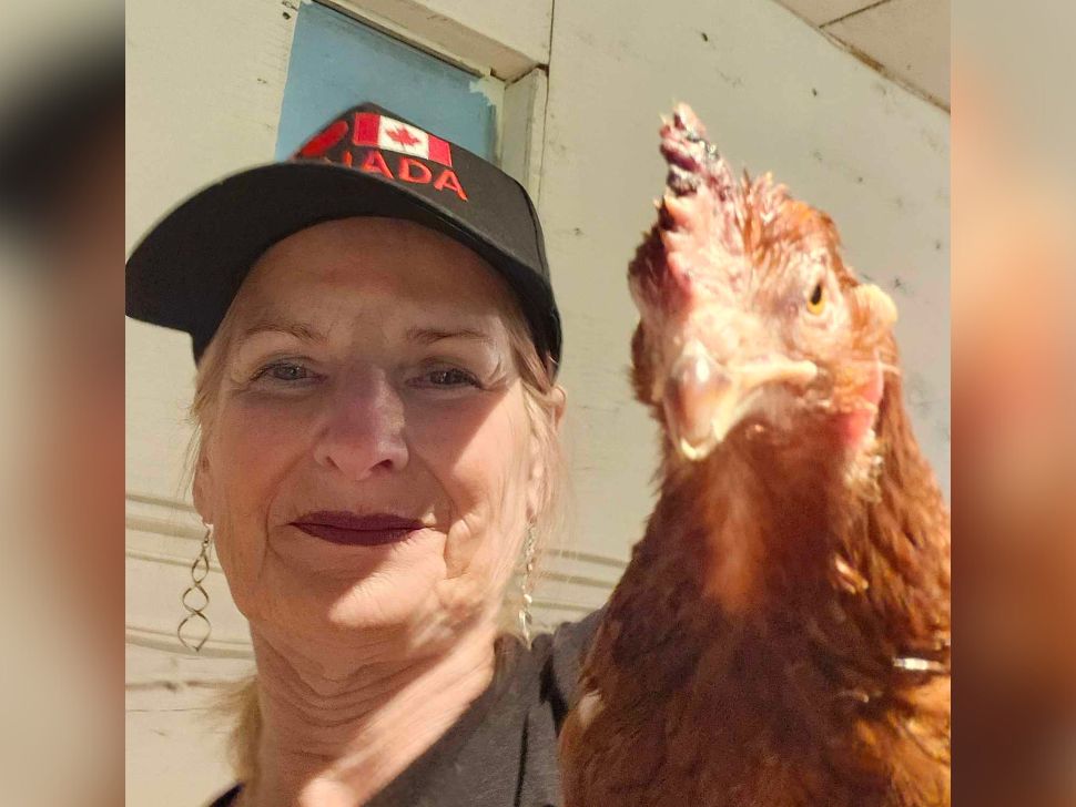 AnnMarie Penner with her chicken, from southern Manitoba.