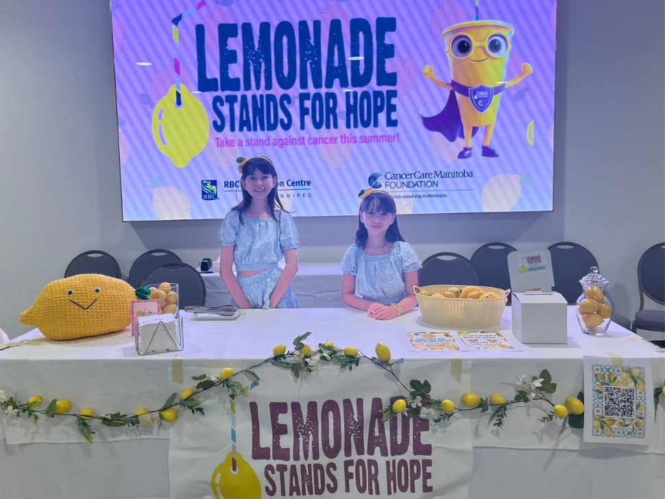 Erika and Carly at their Lemonade Stand at RBC Convention Centre. 