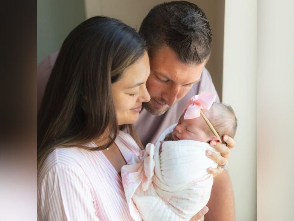 Tim and Demi Tebow with their new daughter, Daphne Reign. 