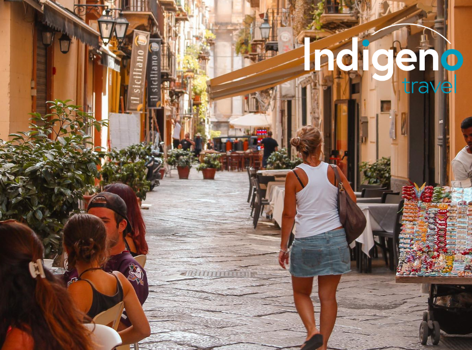 a woman walks through the streets of Sicily