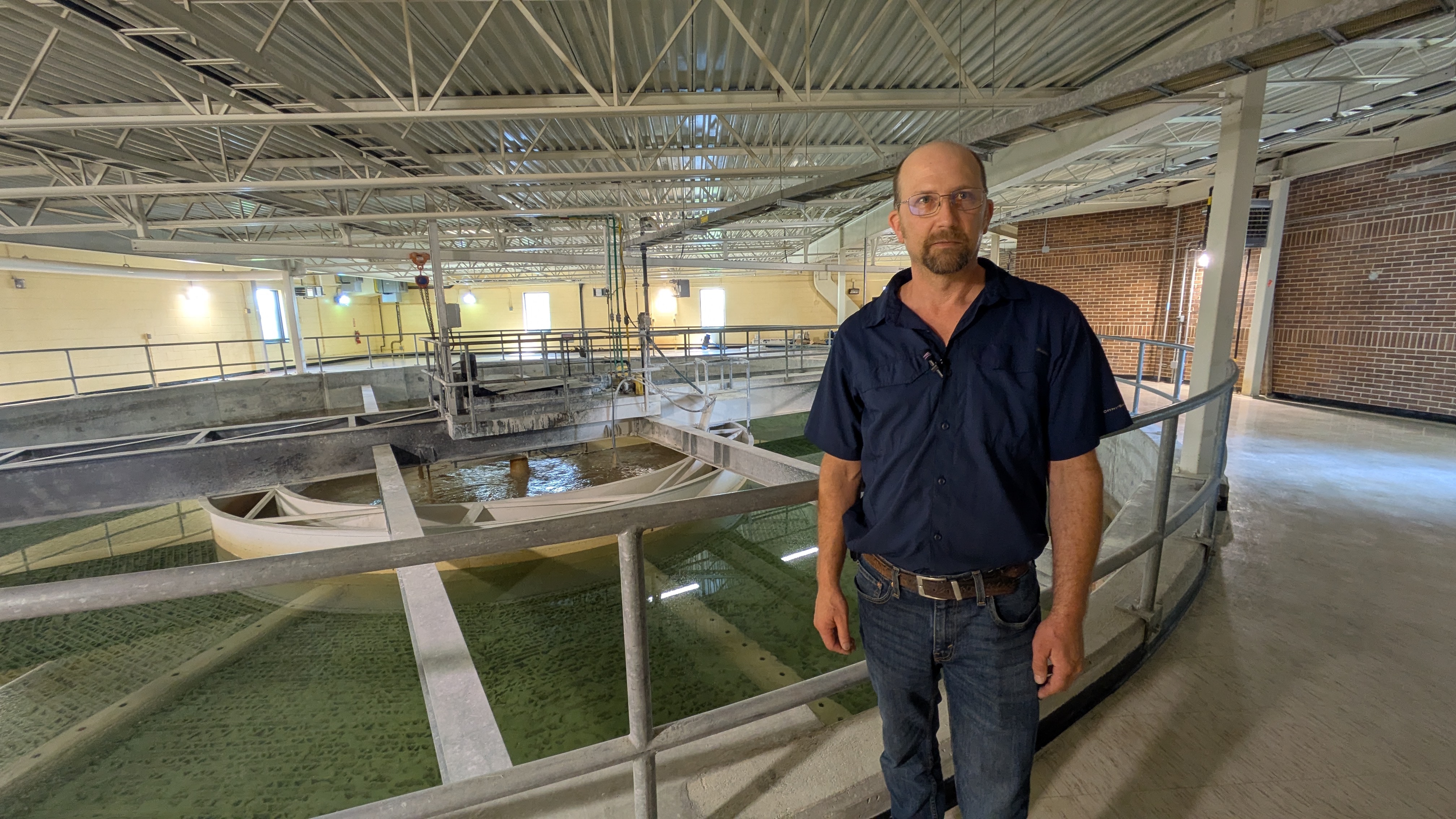 Smith beside water clarifier