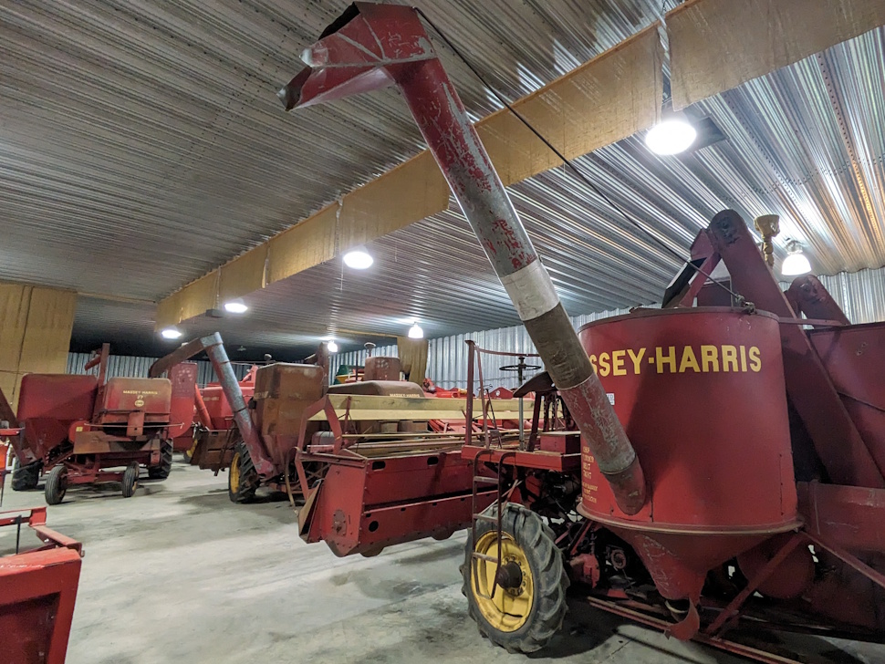 Vintage agricultural equipment displayed outdoors at the Manitoba Agricultural Museum.